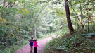 Children walking on path in family forest
