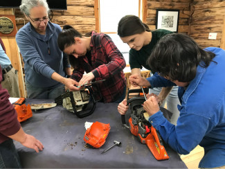 Women's chainsaw safety and maintenance